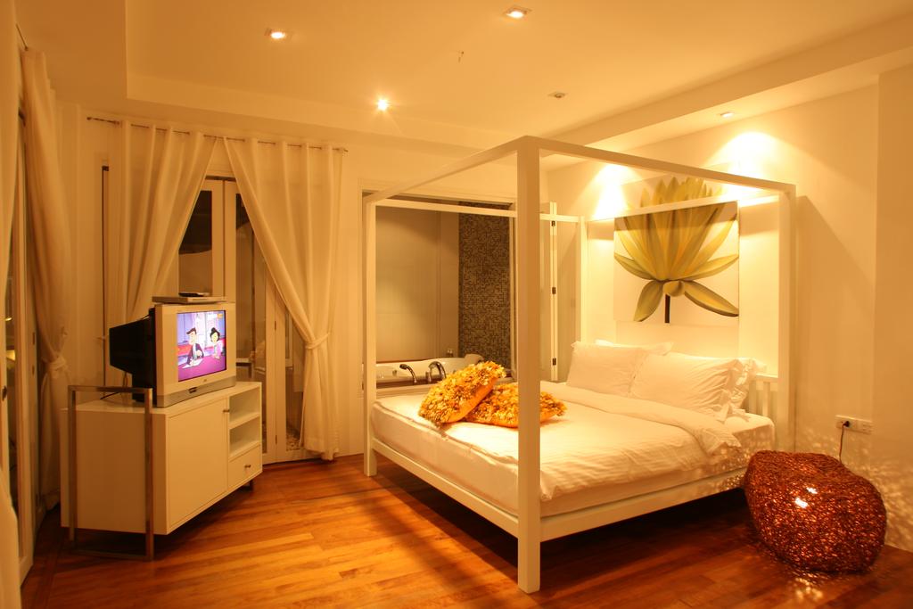 Villa Nalinnadda - кровать в номере